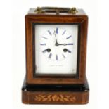 LAINE OF PARIS; a late 19th century rosewood and marquetry inlaid boudoir clock with swing brass