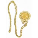 A French gold 20 francs, 1910, in a yellow metal mount on a yellow metal chain stamped 14K,