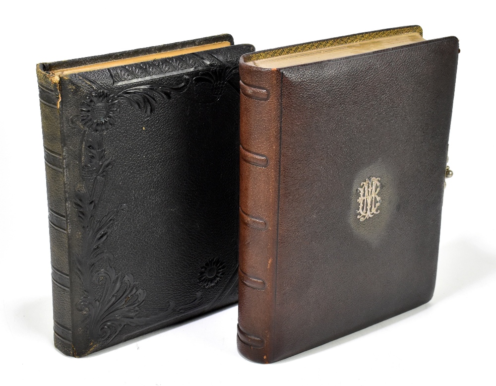 Two Victorian photograph albums including an example with applied white metal initials, possibly '