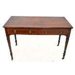 An Edwardian mahogany two drawer side table, with brass ring loop handles and tapered legs, height