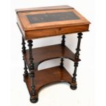 A late Victorian walnut writing table/whatnot, with leather inset top above two shelves, height