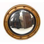 A Regency style gilt convex wall mirror, diameter 49cm.