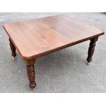 An Edwardian dining table with canted corners  on turned legs, height 70cm, length 139, depth