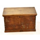 A late 19th century camphor wood chest, with hinged lid and wrought iron brass handles on plinth