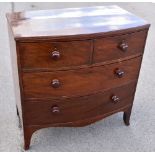An early Victorian mahogany bowfronted chest of two short and two long drawers, on bracket feet,