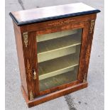 A Victorian inlaid walnut pier cabinet with glazed door enclosing shelves, on plinth base, height