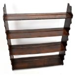 A 19th century oak four tier wall shelf with shaped edges, height 105cm, width 89cm, depth 23cm.