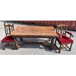 A late 19th century Carolean style carved oak draw leaf dining table, with foliate carved baluster