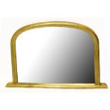 A modern gilt framed overmantel mirror of arched form, width 120cm, height 79cm.