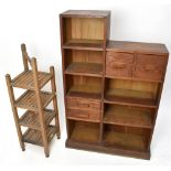 A 1920s oak open shelf unit, with an arrangement of four drawers and seven shelves on plinth base,