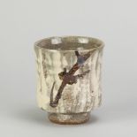 WILLIAM MARSHALL (1923-2007); a stoneware yunomi covered in brushed slip with iron decoration,