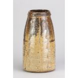 BERNARD LEACH (1887-1979) for Leach Pottery; a tall stoneware vase covered in iron and oatmeal glaze