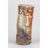 WAYNE CLARK; a tall wood fired stoneware square vessel with interlocking cover partially covered