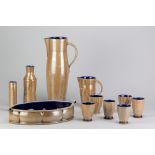 ALISTAIR YOUNG; a group of salt glazed ceramics with added porcelain decoration and dark blue