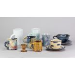 A group of mugs, cups and saucers and an egg cup by different makers including Matthew Blakely, Jane