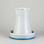 NATASHA DAINTRY (born 1966); a porcelain waisted vase and dish covered in celadon glaze, impressed