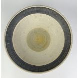 A large stoneware bowl covered in oatmeal glaze with a band of incised manganese below the rim,