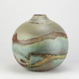 ABDO NAGI (1941-2001); a large stoneware globular vase covered in pitted green glaze with iron and