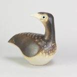 PETER LANE (born 1932); a stoneware sculpture of a bird, incised signature and label, height 20.5cm.