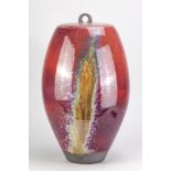 PETER SPARREY (born 1967); a very large jar and cover partially covered in copper red and illemite