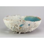 TAMSYN TREVORROW (born 1975); a large grogged stoneware cut out bowl with glass like pooling to