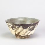 WILLIAM MARSHALL (1923-2007) for Leach Pottery; a deep stoneware bowl partially covered in brushed