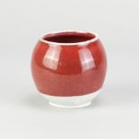 ADAM BUICK (born 1978); a mini porcelain moon jar covered in copper red glaze, impressed AB mark,