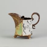 WENDY BARLOW (born 1958); a stoneware footed jug decorated with slips and glazes, impressed WB mark,