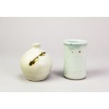 Leach Pottery; a porcelain bud vase covered in celadon glaze with iron decoration, impressed pottery