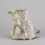 AKI MORIUCHI (born 1947); a stoneware jug form with heavily textured surface, impressed mark, height