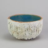 TAMSYN TREVORROW (born 1975); a grogged stoneware blue sculptural bowl, impressed TT mark,