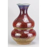 ADRIAN LEWIS-EVANS (1927-2021); a large stoneware double gourd bottle covered in copper red and