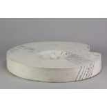 GORDON BALDWIN (born 1932); an earthenware disc form covered in white pigment with bluish hues and