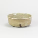 NORAH BRADEN (1901-2001); a stoneware bowl covered in green ash glaze with incised decoration,