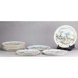 PETER CLOUGH (born 1944); a set of nine grogged porcelain plates decorated with moorland landscapes,