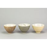 ANNA SYKORA; three Limoges porcelain bowls with different terra sigillata surfaces and sgraffito