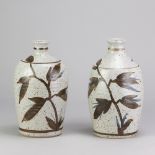 PETER CLOUGH (born 1944) for Nantwich Pottery; a near pair of stoneware lamp bases decorated with