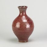 ADRIAN LEWIS-EVANS (1927-2021); an early stoneware bottle covered in mottled copper red glaze,