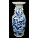 A large Chinese blue and white twin handled vase decorated with a phoenix over landscape over a