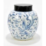 A 19th century Chinese blue and white porcelain ginger jar with associated wooden cover, decorated