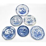 Four 18th century Chinese Export blue and white porcelain plates of octagonal form, decorated with