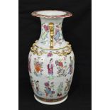 A 19th century Chinese Famille Rose vase with moulded Dogs of Fo and mythical creatures to the body,