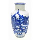A late 19th century Chinese blue and white painted vase decorated with a continuous landscape,