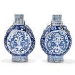 A pair of late 19th century Chinese blue and white moon flasks, each decorated with four claw
