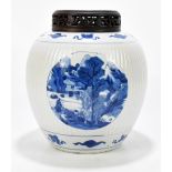 A Kangxi period Chinese blue and white porcelain vase with ribbed linear detail, the three