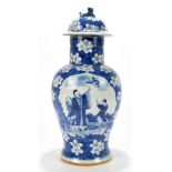 A 19th century Chinese blue and white porcelain temple jar and cover, decorated with figures and