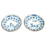 Two Chinese blue and white saucers, possibly Kangxi, decorated with deer, diameter 11cm (2)