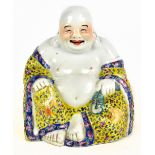 A 19th century Chinese porcelain Famille Rose figure of Hotei, impressed seal mark to base, height