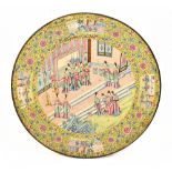 A 19th century Chinese enamel charger decorated with figures inside floral detail and four panels