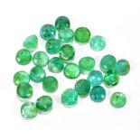 EMERALDS; a group of round facet cut stones weighing 12.09ct, each 4.75mm.